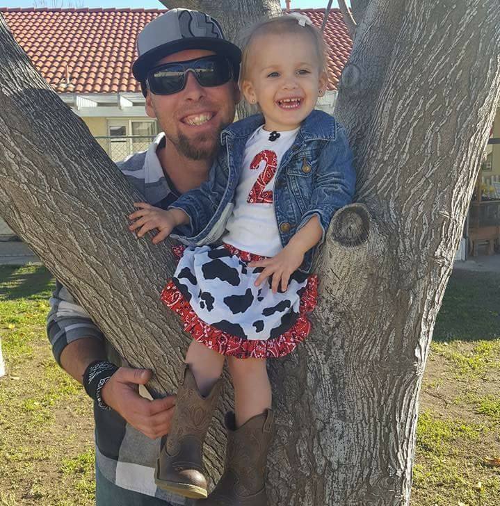Geoff with his daughter in a tree